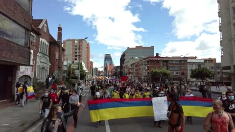 Protest or march during colombian National Strike against Ivan Duque in Bogota Stock Footage 153934406