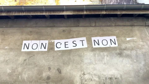 Protest poster stuck on a wall saying "no is no" in Paris, France Stock Footage 249677545