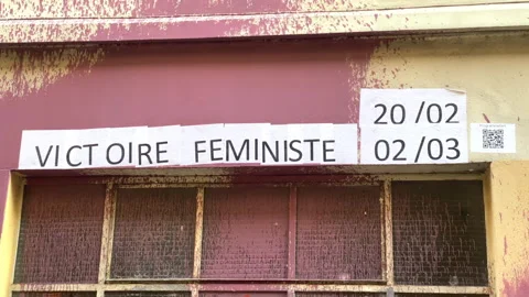Protest poster stuck on a wall saying "feminist victory" in french Stock Footage 249677611