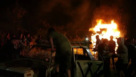 Protest, Riot, Demonstration In The City, Fire. People Break The Car. Sabotage Stock Footage 82171434