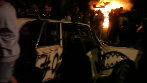 Protest, Riot, Demonstration In The City, Fire. People Break The Car. Sabotage Stock Footage 82171688