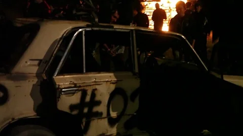 Protest, Riot, Demonstration In The City, Fire. People Break The Car. Sabotage Stock Footage 82171777
