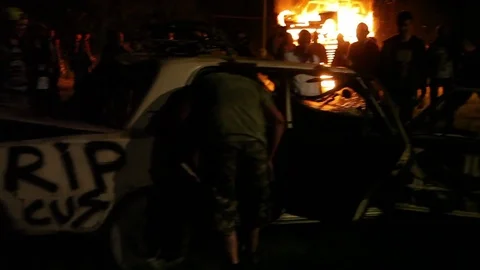 Protest, Riot, Demonstration In The City, Fire. People Break The Car. Sabotage Stock Footage 82171922