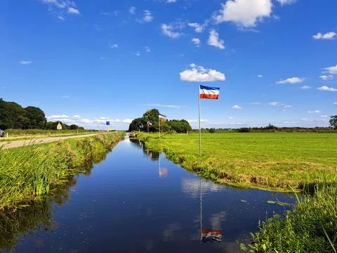 Protest signs and rows of flags upside down in Lekkerkerk along the N210 in.. Stock Photos