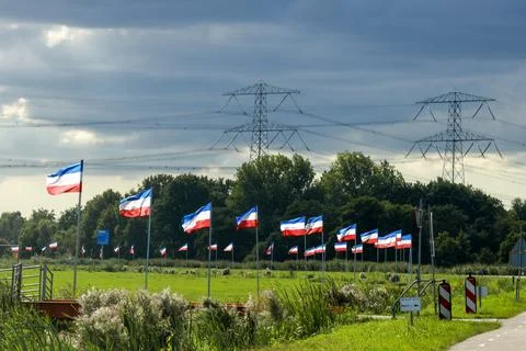 Protest signs and rows of flags upside down in Lekkerkerk along the N210 in.. Stock Photos