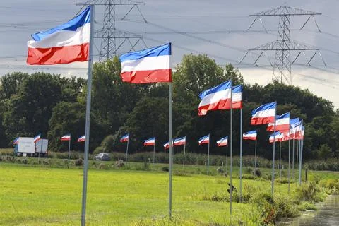 Protest signs and rows of flags upside down in Lekkerkerk along the N210 in.. Stock Photos