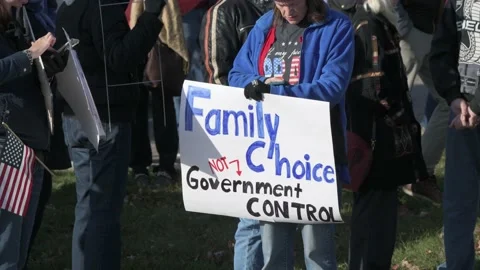 Protest to stop masking and vaxing the children Video stock 164880642