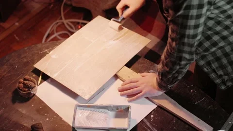 Protest uses a roller to prime a protest banner Stock Footage 143785062