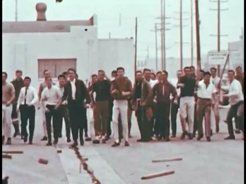 A protest which has become unruly during the 1960s is broken up by a trained Stock Footage 74936088