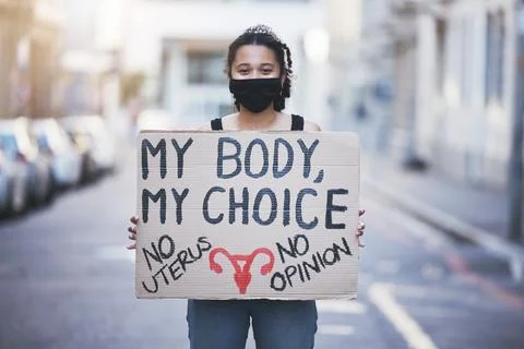 Protest woman, abortion choice or healthcare cardboard poster in a city street Stock Photos
