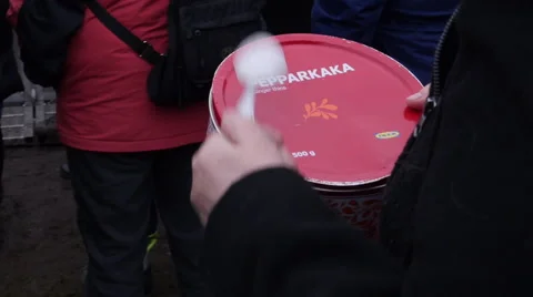 Protester drumming in cookie box Stock Footage 61919076