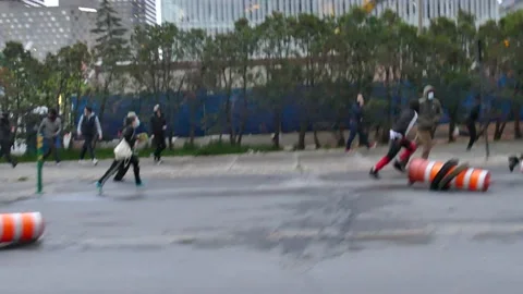 Protester falling while running from anti-riot police Stock Footage 132483988