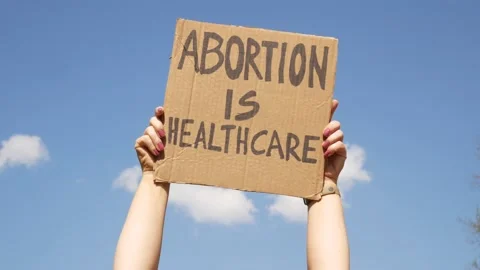 Protester holding placard supporting abortion rights. Stock Footage 194255177
