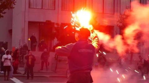 Protester pitching red light during protest Stock Footage 92440902