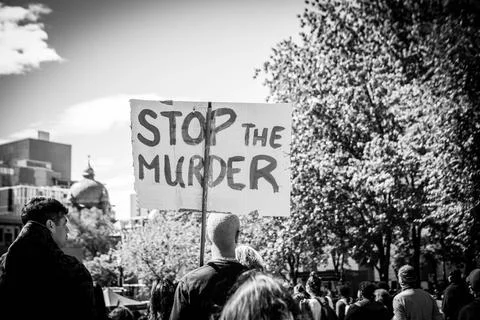 Protester with placard protesting in city Stock Photos