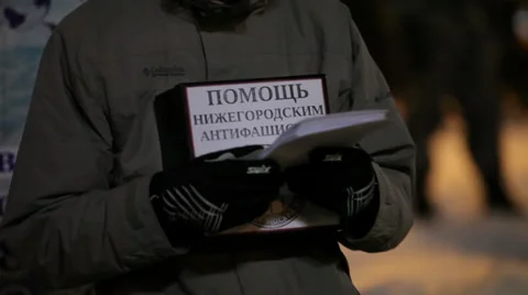 Protester with poster "Help for anti-fascist of Nizhniy Novgorod" Stock Footage 30461561