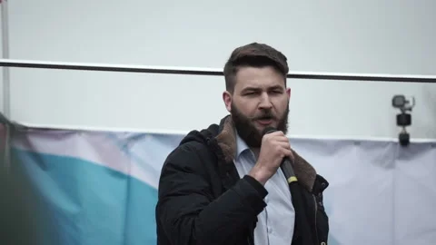 Protester speaker during strike rally gives speech address with microphone. Stock Footage 164885217