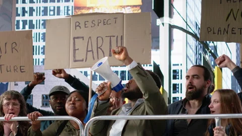 Protesters and demonstrators gather in a large environmental rally Stock Footage 327338694