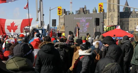 Protesters and Speaker on Stage in Front of Parliament in Ottawa With Flags Stock-Footage 170335223