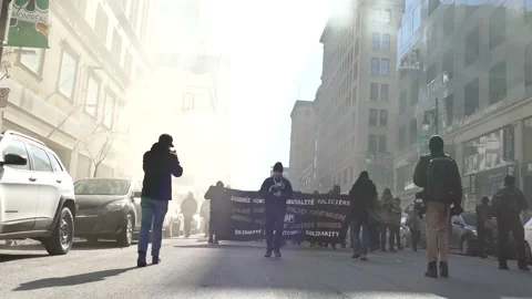 Protesters approaching with smog Stock Footage 138496388