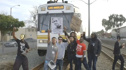 Protesters block the Metro Blue Line train in Compton Video stock 82243764