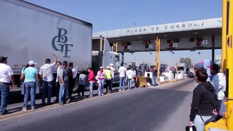 Protesters blockaded a main highway and shut down toll booths. Stock Footage 78196873