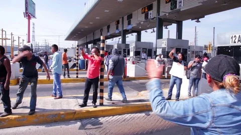 Protesters blockaded a main highway and shut down toll booths. Stock Footage 78205511