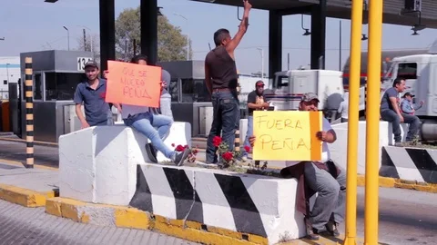 Protesters blockaded a main highway and shut down toll booths. Stock Footage 78205612
