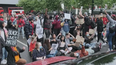 Protesters Blocking London Street chanting "No Justice, No Peace" BLM Protest Stock Footage