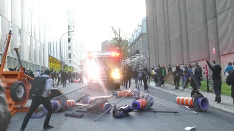 Protesters blocking street to protesters during riot Stock Footage 132378808