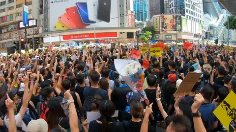Protesters booing and giving middle fingers at massive political rally Hong Kong Stock-Footage 112430098