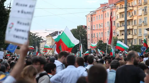 Protesters brandishing flags in the square Video stock 38917767