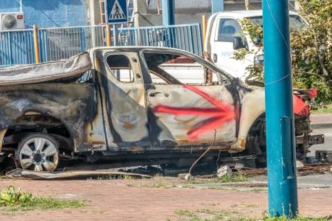 Protesters burn vehicles to block the main road on french Saint Martin. The M Stock Photos