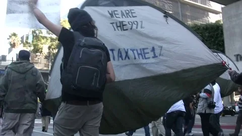 Protesters carry a tent during an Occupy Los Angeles protest Stock-Footage 77740432