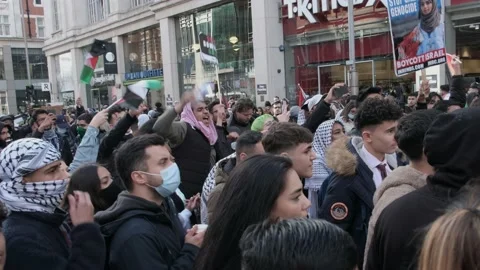 Protesters chant at free Palestine protest at Embassy of Israel in London Stock Footage 155503115