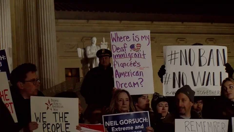 Protesters chant while holding signs at the steps of the US Supreme Court in  Video stock 125868319