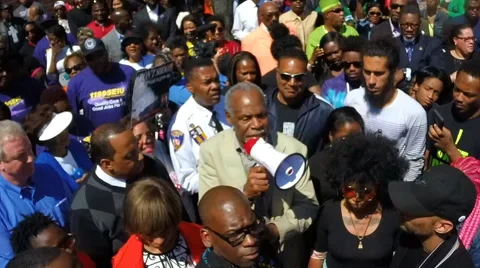 Protesters commemorate the Baltimore riots one-year later. Stock Footage 62533692