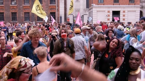 Protesters Dance 'blood' covered Ground at XR Blood Money Protest Stock Footage 160151385