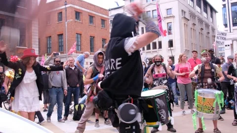 Protesters Dancing to Drums at Extinction Rebellion Blood Money Protest Stock Footage 160151504