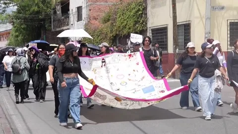 Protesters demonstrate against femicides during the Independence Day parade in C Видео 345689552