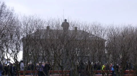 Protesters in the distance, behind the trees Stock Footage 61919079