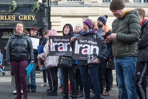 Protesters with Dont Attack Iran sign at rally demonstration Stock Photos