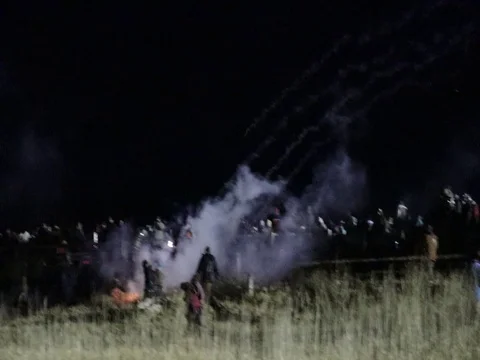 Protesters extinguish fires set by tear gas - Standing Rock Sioux Tribe Stock Footage
