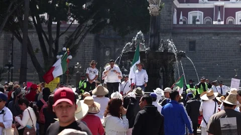 Protesters Gather Around San Miguel Fountain in Puebla Zocalo, Mexico Stock Footage 342107494
