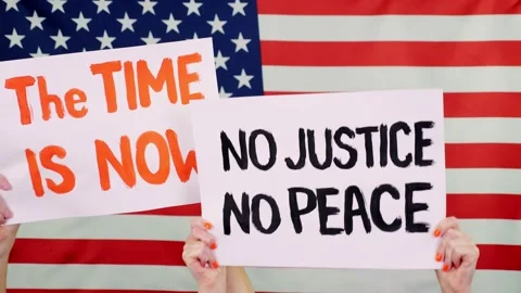 Protesters hold banners with slogans - The Time is now. NO JUSTICE NO PEACE - Stock-Footage 132003257