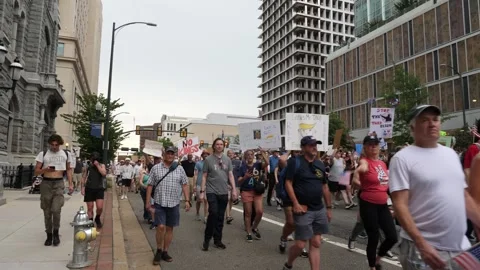 Protesters hold inflammatory signs during the No Kings protest in Richmond Stock-Footage 311610982