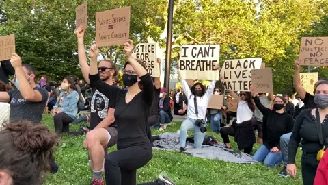 Protesters hold posters during Black Lives Matter protest on June 1, 2020 Stock Footage 131577257