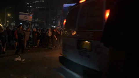 Protesters making way for ambulance at a judicial reform demonstration Tel Aviv Stock Footage 239003186