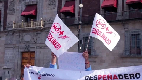 Protesters march and shout slogans against a planned rise in fuel prices. Stock Footage 78215433