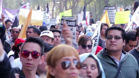 Protesters march and shout slogans against a planned rise in fuel prices. Stock Footage 78226674